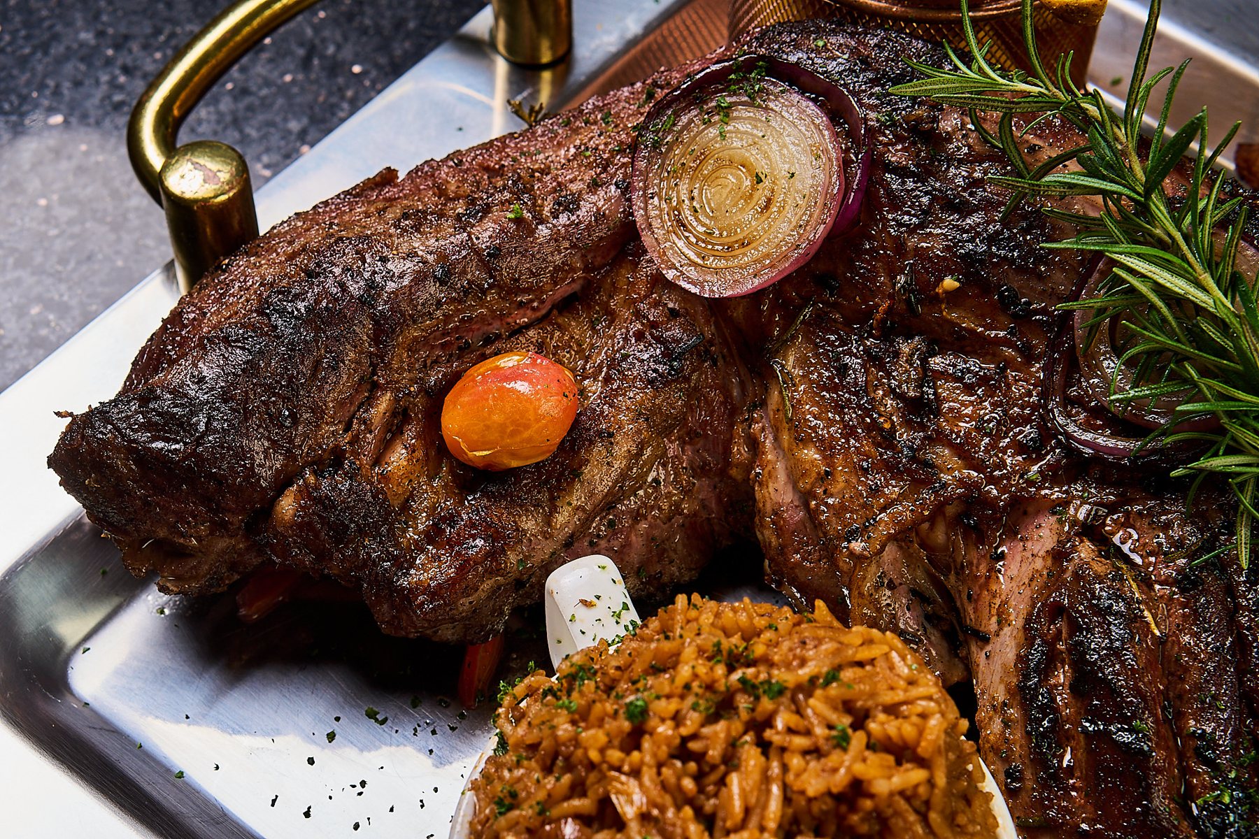 Slow-roasted ribs with jollof rice